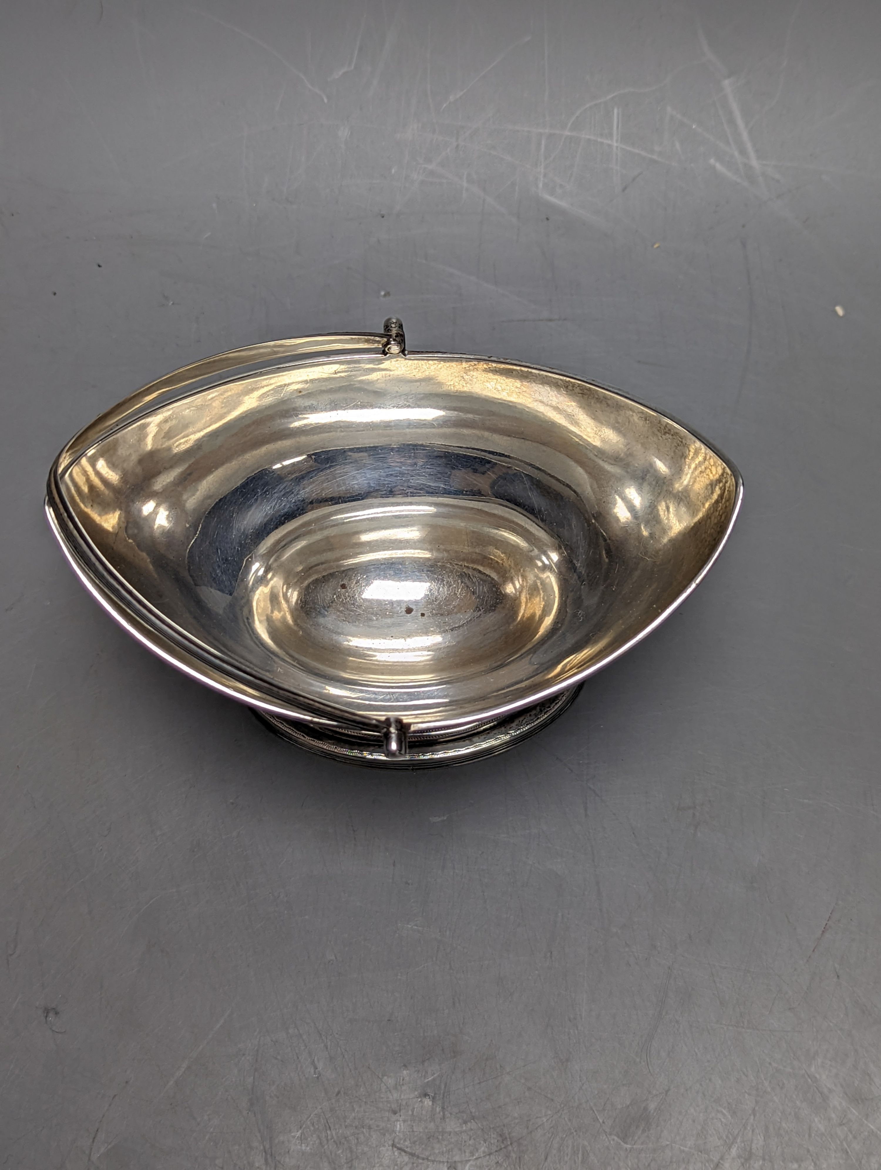 A George III silver boat shaped sugar basket by Peter & Ann Bateman, London, 1799, length 13.9cm, 5oz.